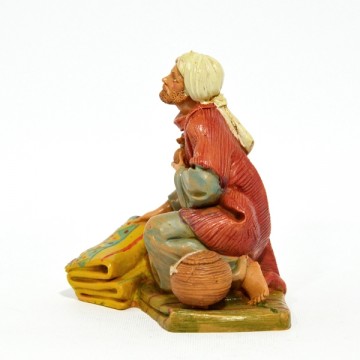 Statua Uomo su Tappeto...