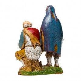 Pastori seduti vicino al Fuoco per il Presepe